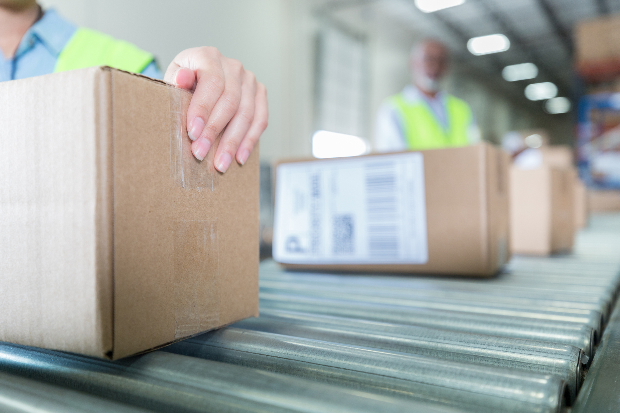 Boxes on fulfilment conveyor belt ready for next day delivery dispatch