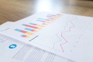 Papers showing data in the form of graphs and charts.