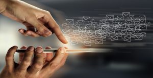 Illustration of a finger pressing an iPhone with email icons