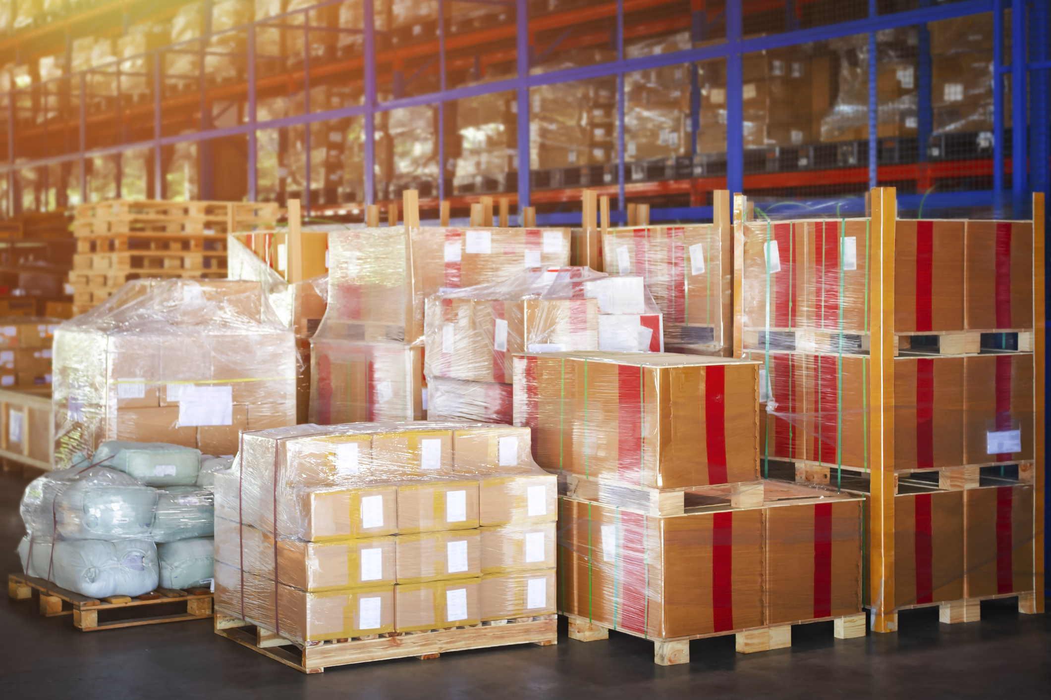 Over Stocked Package Boxes Stacked on Pallets in Storage Warehouse. Storehouse Distribution Storage Tall Shelf. Supply Chain. Shipping Cargo Supplies Warehouse Logistics.